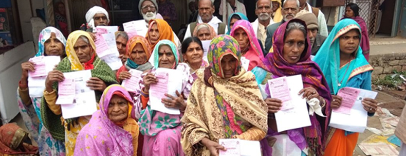 Group of elderly women holding health documents in their hands