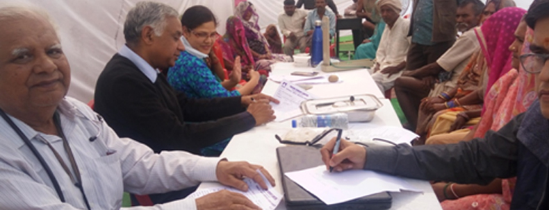 Doctors conducting free medical check-up for villagers during Prism Cement CSR health camp