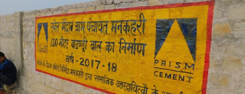 Prism Cement wall painting showing CSR project details for 130-meter boundary wall