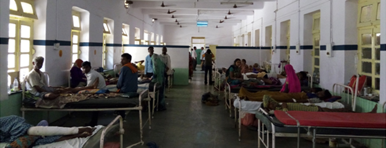 Patients receiving treatment in a rural hospital ward with improved medical facilities