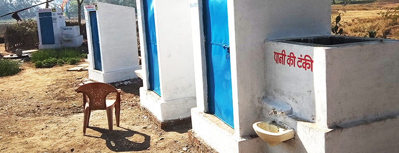 Newly constructed toilets with water tanks under Swachh Bharat Mission promoting rural sanitation and hygiene
