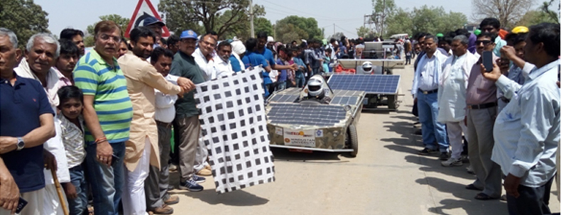 People gathered to witness a solar car race event in India