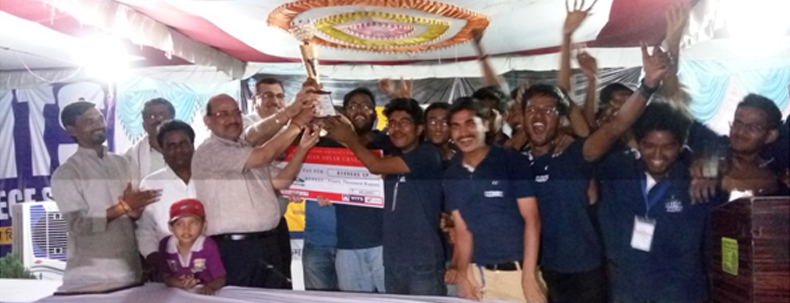 Winners celebrating with trophy during sports event prize distribution ceremony