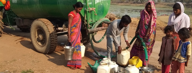 Villagers collecting clean water from tanker provided by Prism Cement